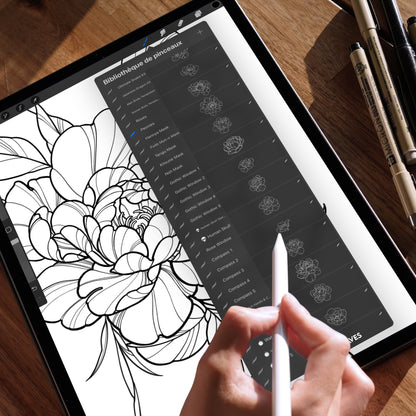 iPad screen showing a detailed floral Procreate composition using peony line art brushes, with visible brush library on the right and a pencil hand in action
