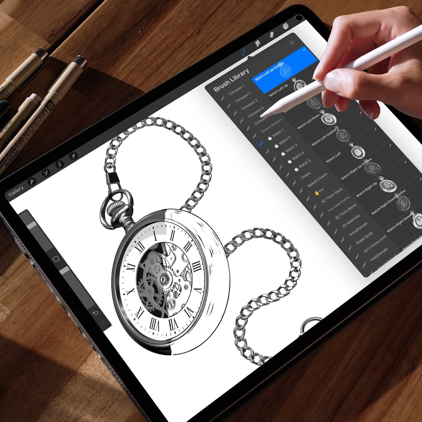 Procreate interface on iPad displaying multiple pocket watch designs created with stamp brushes. A hand is selecting a specific pocket watch brush from the brush menu.