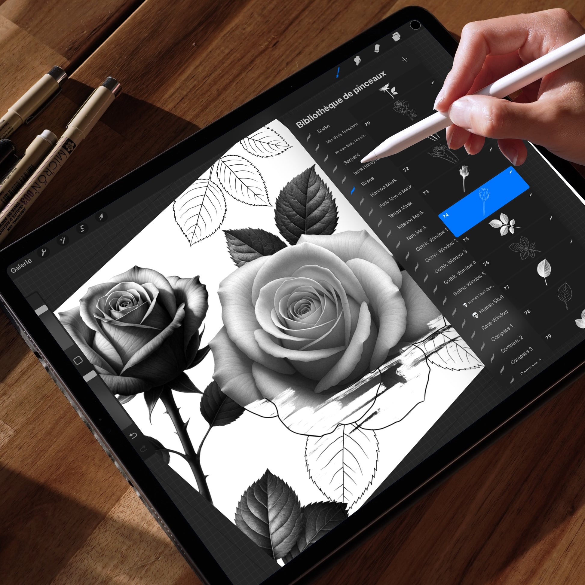 An iPad displaying two realistic Procreate rose brushes, one in full bloom and one partially open, with a visible Procreate brush library on the right and a hand using an Apple Pencil.